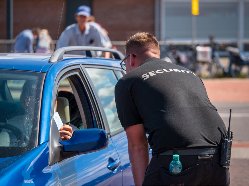 security guard talking to driver