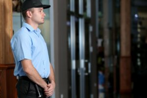 male security guard at workplace entrance